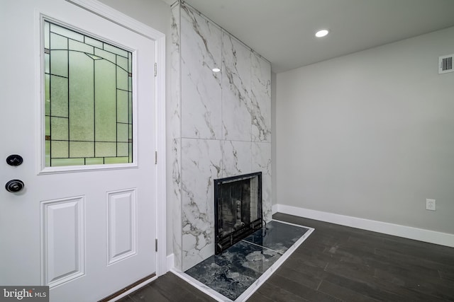 8808 Edmonston Rd, College Park, MD 20740 - unfurnished living room featuring dark wood finished floors, a premium fireplace, and recessed lighting