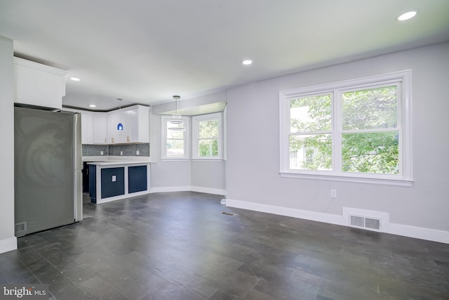8808 Edmonston Rd, College Park, MD 20740 - unfurnished living room with recessed lighting and dark wood-style floors