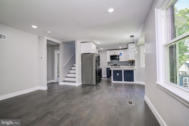 8808 Edmonston Rd, College Park, MD 20740 - unfurnished living room with stairs, dark wood-style flooring, and recessed lighting