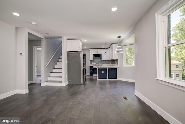 8808 Edmonston Rd, College Park, MD 20740 - unfurnished living room featuring recessed lighting, dark wood-type flooring, and stairs