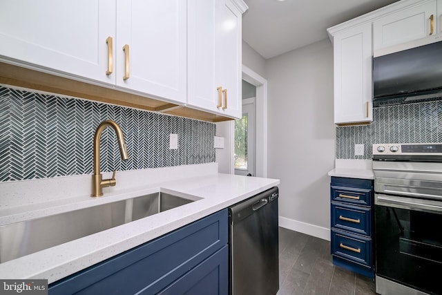 8808 Edmonston Rd, College Park, MD 20740 - kitchen with stainless steel appliances, blue cabinetry, backsplash, and white cabinetry