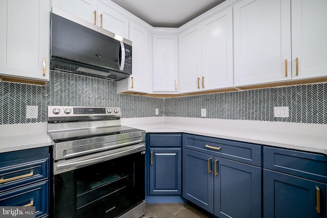 8808 Edmonston Rd, College Park, MD 20740 - kitchen featuring stainless steel appliances, blue cabinets, light countertops, and tasteful backsplash