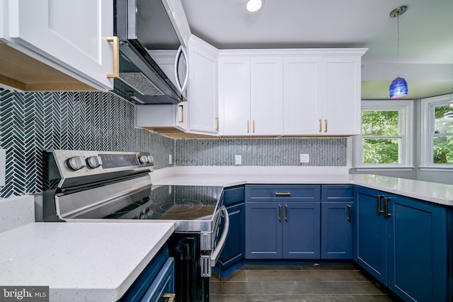 8808 Edmonston Rd, College Park, MD 20740 - kitchen featuring appliances with stainless steel finishes, blue cabinets, light countertops, and white cabinets