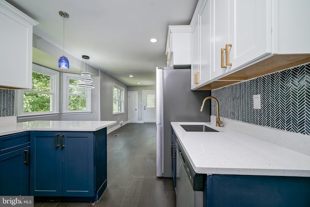 8808 Edmonston Rd, College Park, MD 20740 - kitchen featuring blue cabinetry, tasteful backsplash, white cabinetry, dark wood-type flooring, and decorative light fixtures