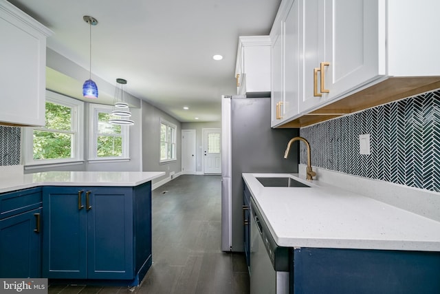 8808 Edmonston Rd, College Park, MD 20740 - kitchen with blue cabinetry, stainless steel dishwasher, decorative backsplash, white cabinetry, and dark wood finished floors