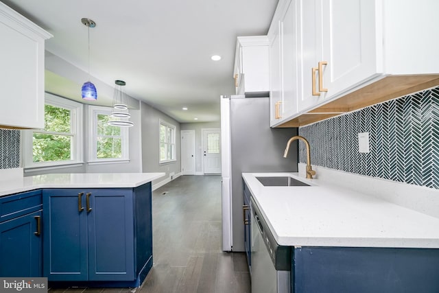 8808 Edmonston Rd, College Park, MD 20740 - kitchen with blue cabinetry, white cabinets, tasteful backsplash, dishwasher, and decorative light fixtures