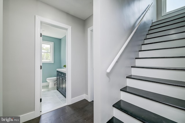 8808 Edmonston Rd, College Park, MD 20740 - stairway with baseboards and wood finished floors