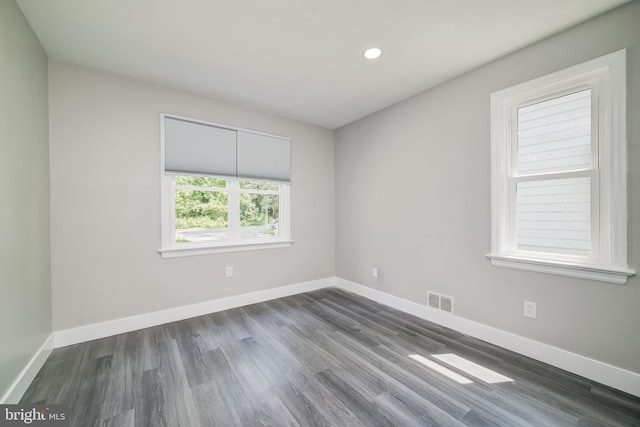8808 Edmonston Rd, College Park, MD 20740 - unfurnished room with dark wood-style flooring and recessed lighting
