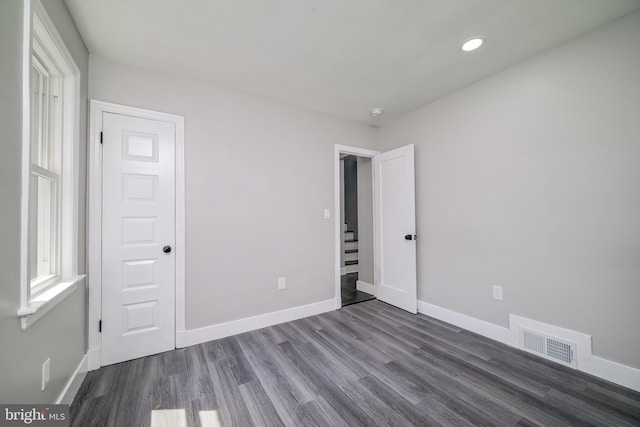8808 Edmonston Rd, College Park, MD 20740 - unfurnished bedroom featuring dark wood finished floors and recessed lighting