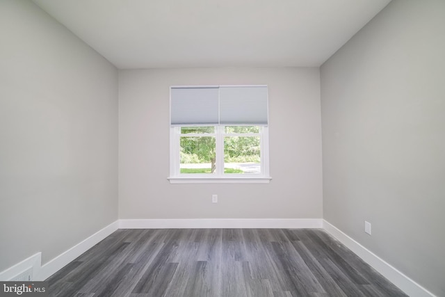 8808 Edmonston Rd, College Park, MD 20740 - unfurnished room with dark wood-type flooring and baseboards