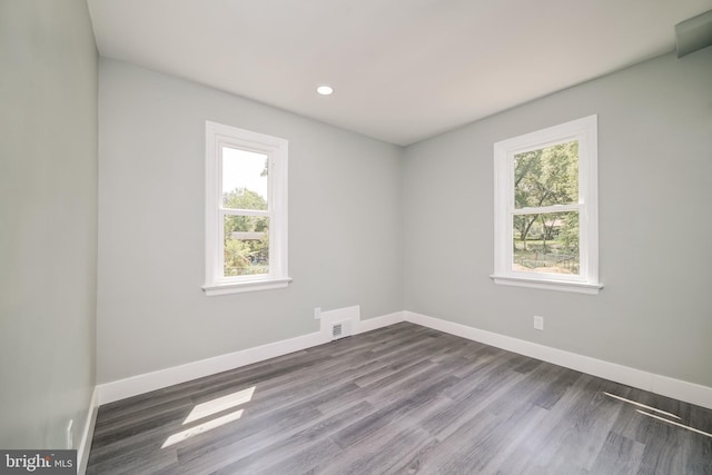 8808 Edmonston Rd, College Park, MD 20740 - empty room with dark wood-style floors and recessed lighting
