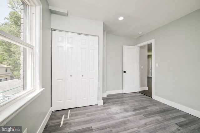 8808 Edmonston Rd, College Park, MD 20740 - unfurnished bedroom featuring wood finished floors, a closet, and recessed lighting