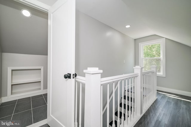 8808 Edmonston Rd, College Park, MD 20740 - hallway with lofted ceiling, an upstairs landing, built in shelves, dark wood-type flooring, and recessed lighting