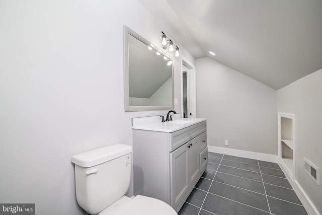 8808 Edmonston Rd, College Park, MD 20740 - bathroom featuring vaulted ceiling, vanity, and tile patterned floors