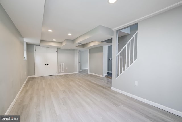 8808 Edmonston Rd, College Park, MD 20740 - finished below grade area with light wood-style flooring, recessed lighting, and stairway