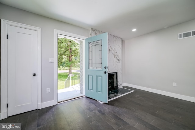 8808 Edmonston Rd, College Park, MD 20740 - entryway featuring dark wood finished floors, recessed lighting, and a high end fireplace