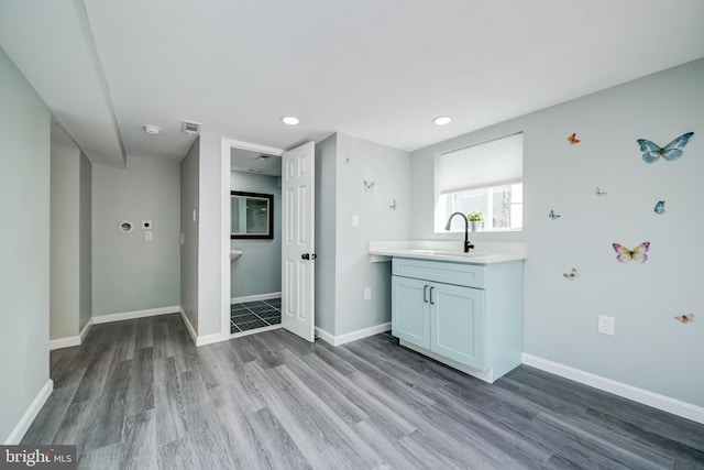 8808 Edmonston Rd, College Park, MD 20740 - bathroom with wood finished floors, vanity, and recessed lighting
