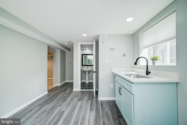 8808 Edmonston Rd, College Park, MD 20740 - kitchen with light countertops, wood finished floors, and recessed lighting