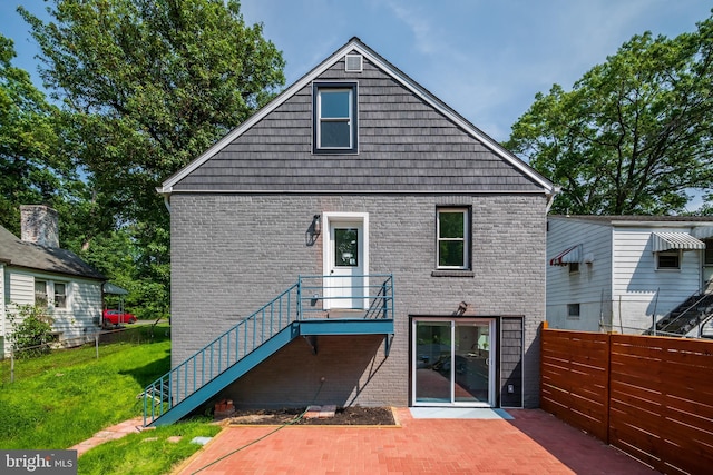 8808 Edmonston Rd, College Park, MD 20740 - back of property with brick siding, a patio, and stairs