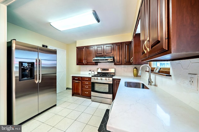 32 Sherbrooke Rd, Ewing, NJ 08638 - kitchen featuring stainless steel appliances, a sink, under cabinet range hood, tasteful backsplash, and light stone counters