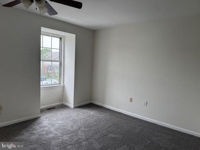 7849 Hidden Crk Unit 24, Baltimore, MD 21226 - carpeted empty room with a ceiling fan and baseboards