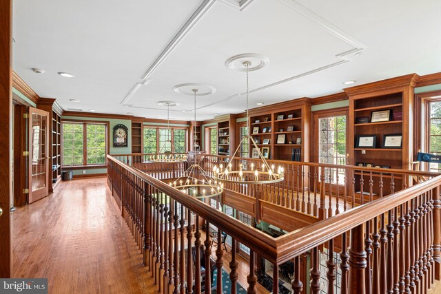 1214 Hunt Seat Dr, Lower Gwynedd, PA 19002 - hall featuring an upstairs landing, crown molding, wood finished floors, plenty of natural light, and a chandelier