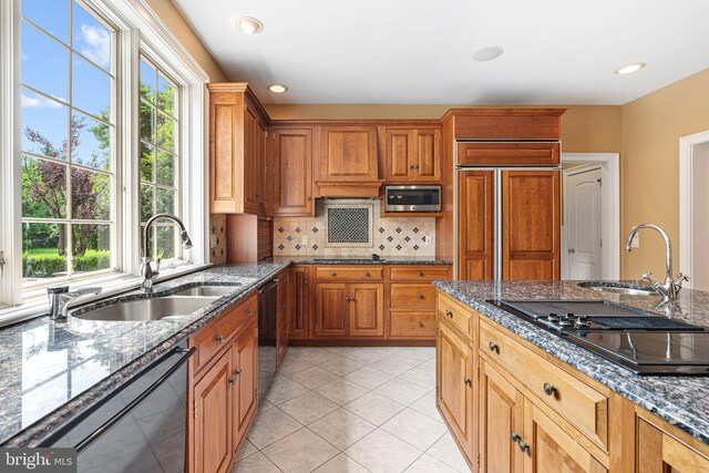1214 Hunt Seat Dr, Lower Gwynedd, PA 19002 - kitchen featuring black appliances, plenty of natural light, decorative backsplash, dark stone counters, and recessed lighting