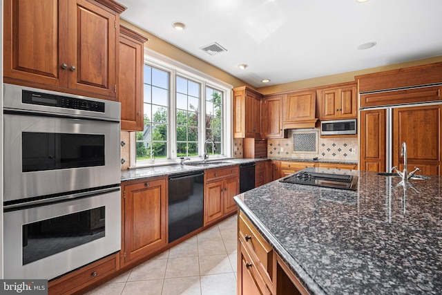 1214 Hunt Seat Dr, Lower Gwynedd, PA 19002 - kitchen with built in appliances, decorative backsplash, brown cabinets, and light tile patterned flooring