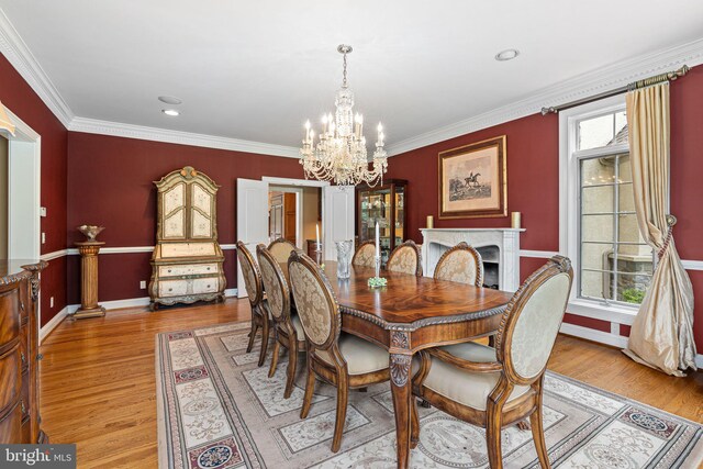 1214 Hunt Seat Dr, Lower Gwynedd, PA 19002 - dining room featuring a chandelier, light wood-style floors, crown molding, a premium fireplace, and recessed lighting