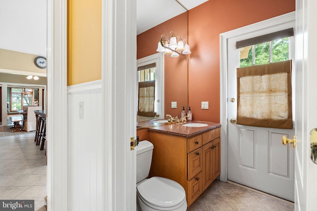 1214 Hunt Seat Dr, Lower Gwynedd, PA 19002 - bathroom with vanity, plenty of natural light, tile patterned floors, and a wainscoted wall