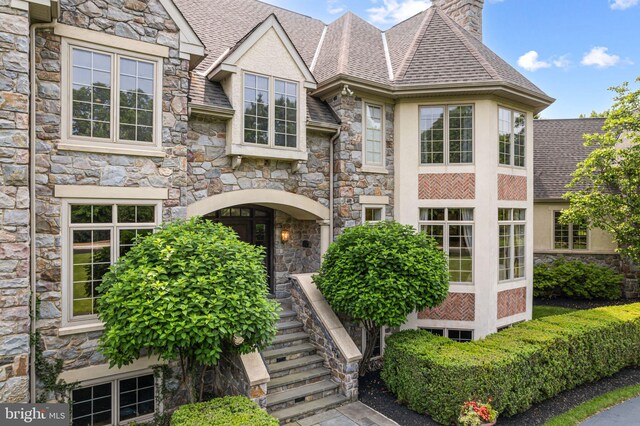 1214 Hunt Seat Dr, Lower Gwynedd, PA 19002 - view of front of house featuring stone siding and roof with shingles