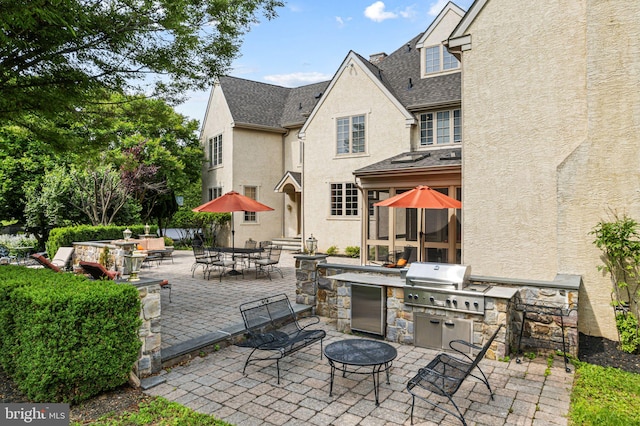 1214 Hunt Seat Dr, Lower Gwynedd, PA 19002 - view of patio with exterior kitchen, outdoor dining area, and a fire pit