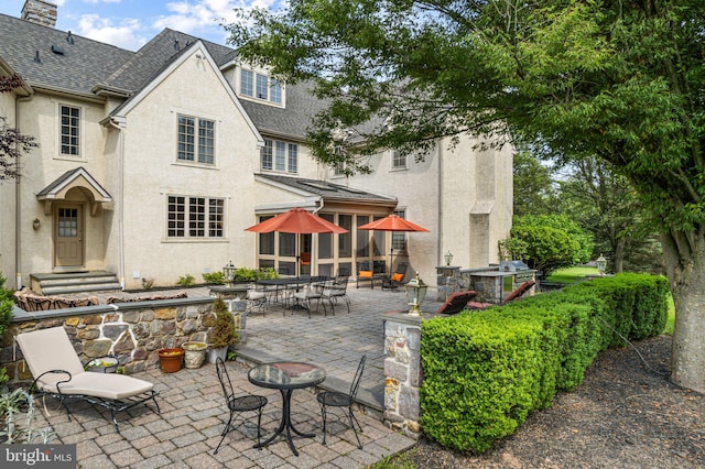 1214 Hunt Seat Dr, Lower Gwynedd, PA 19002 - rear view of property with a shingled roof, a patio, and stucco siding