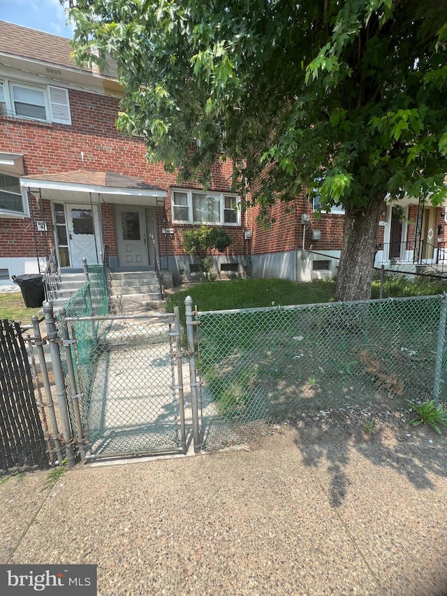 1206 Lakeshore Dr, Camden, NJ 08104 - view of front of property featuring brick siding, a gate, entry steps, and a fenced front yard