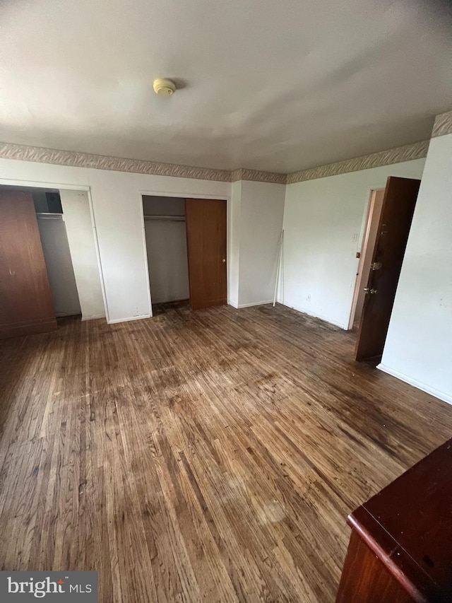 1206 Lakeshore Dr, Camden, NJ 08104 - unfurnished bedroom featuring wood finished floors and multiple closets