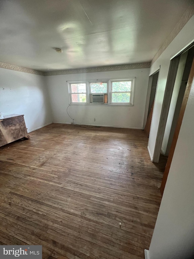 1206 Lakeshore Dr, Camden, NJ 08104 - empty room featuring dark wood-style floors, cooling unit, and a smoke detector
