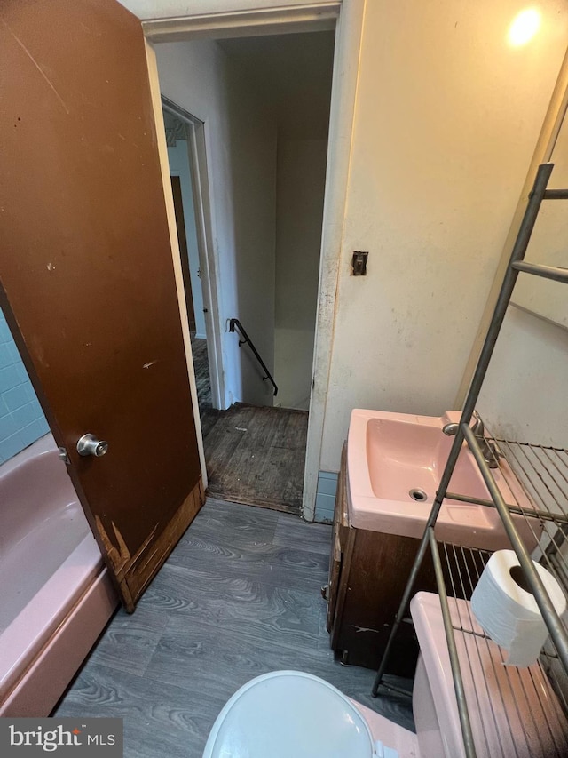 1206 Lakeshore Dr, Camden, NJ 08104 - bathroom featuring vanity, wood finished floors, and a tub to relax in