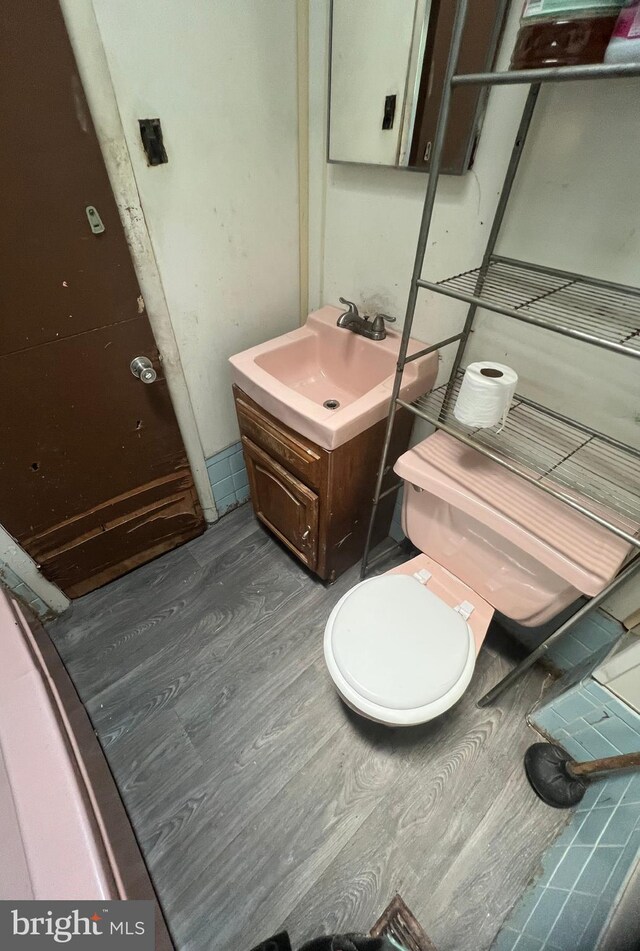 1206 Lakeshore Dr, Camden, NJ 08104 - half bathroom with vanity and wood finished floors