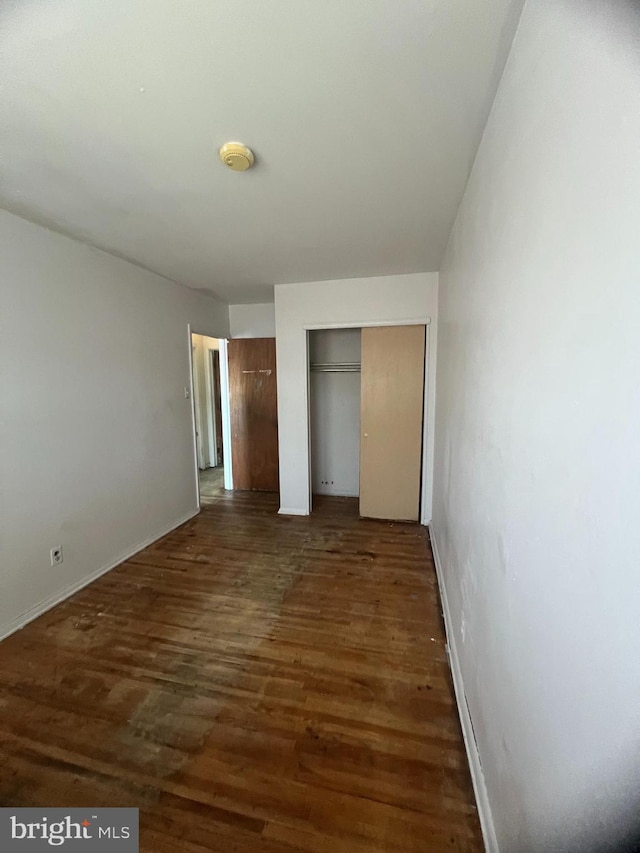 1206 Lakeshore Dr, Camden, NJ 08104 - unfurnished bedroom with wood finished floors and multiple closets