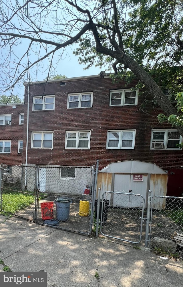 1206 Lakeshore Dr, Camden, NJ 08104 - view of front of property with a gate, a fenced front yard, and brick siding