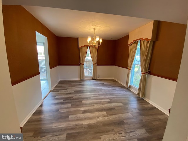 3200 Foothill St, Woodbridge, VA 22192 - unfurnished dining area featuring plenty of natural light, a chandelier, dark wood-style floors, and baseboards
