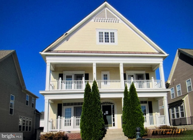 25150 Mineral Springs Cir, Aldie, VA 20105 - view of front of home featuring a balcony, covered porch, and a standing seam roof