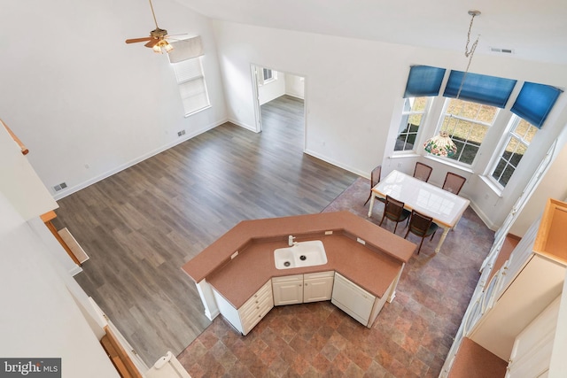 150 Mirage Blvd, Barnegat, NJ 08005 - unfurnished living room featuring a ceiling fan, baseboards, dark wood-style floors, and high vaulted ceiling