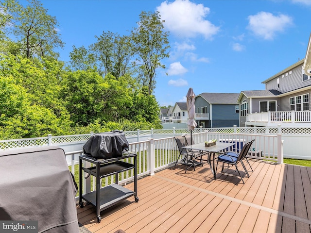 12214 Fallen Timbers Cir, Hagerstown, MD 21740 - wooden deck with outdoor dining area, a fenced backyard, and a residential view