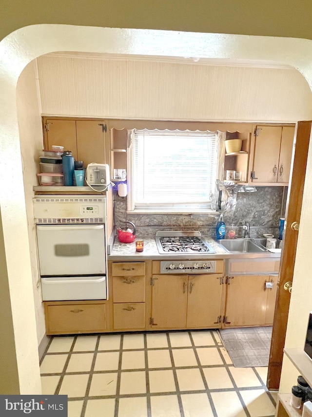635 N 67th St, Philadelphia, PA 19151 - kitchen with oven, a warming drawer, gas cooktop, light floors, and light countertops
