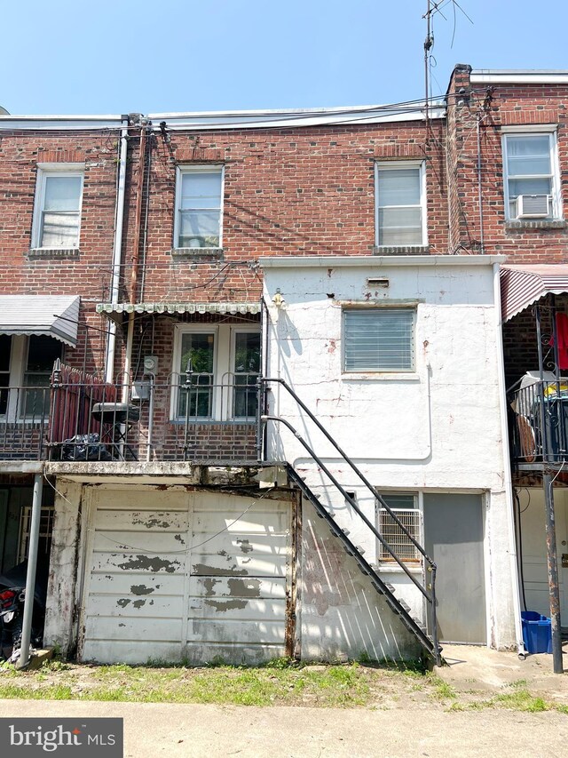 635 N 67th St, Philadelphia, PA 19151 - view of front of house with a garage and brick siding