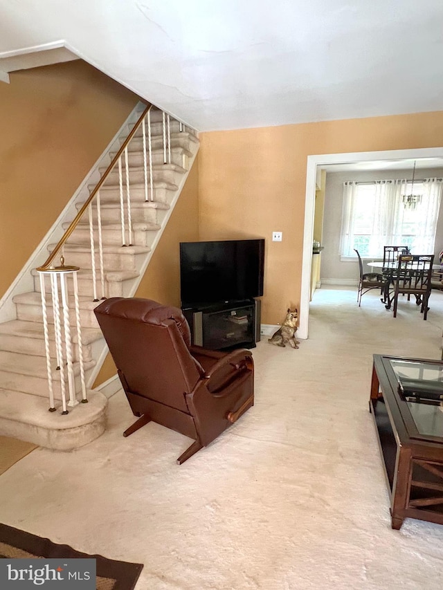 635 N 67th St, Philadelphia, PA 19151 - carpeted living room with stairway and baseboards