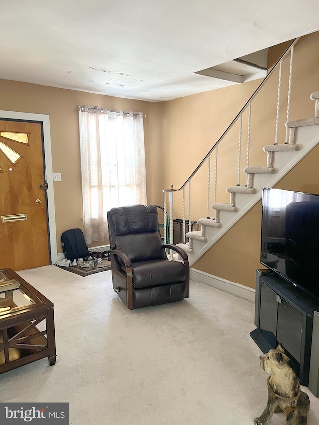 635 N 67th St, Philadelphia, PA 19151 - carpeted living room featuring stairway and baseboards