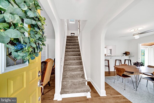 10 Shaw Dr, Kingston, NJ 08528 - stairs with wood finished floors, arched walkways, and ceiling fan