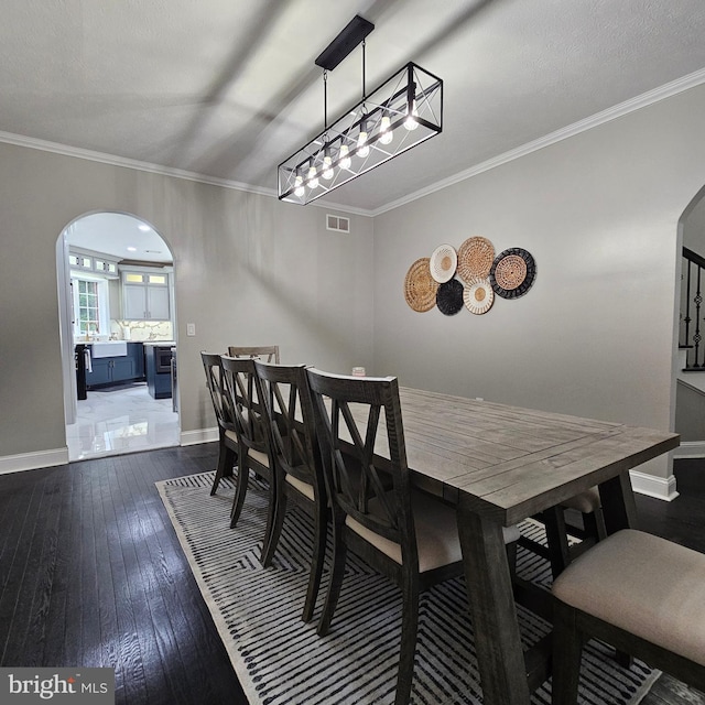 681 Hillcrest Dr, New Creek, WV 26743 - dining room featuring arched walkways, dark wood finished floors, and ornamental molding